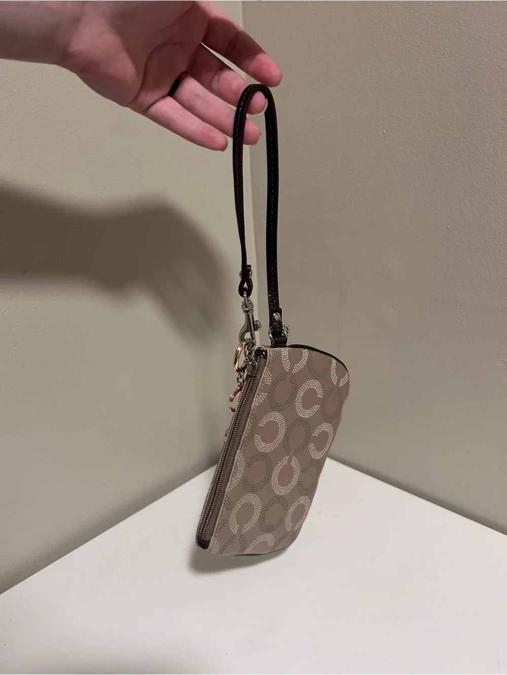 Coach Taupe Signature Canvas Wristlet with Red Charm Accents